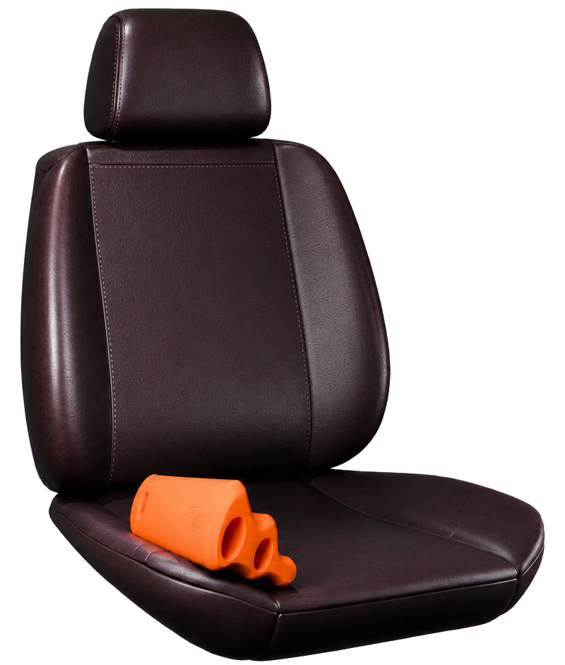 Orange PillowFlow support pillow positioned on a black leather vehicle seat